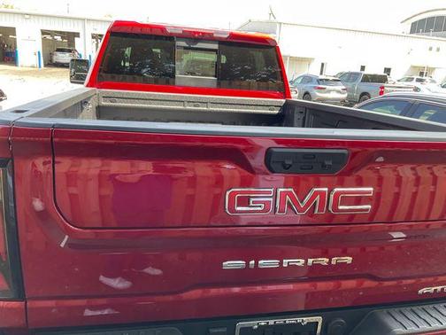 Volcanic Red Tintcoat 2026 GMC Sierra 2500 AT4