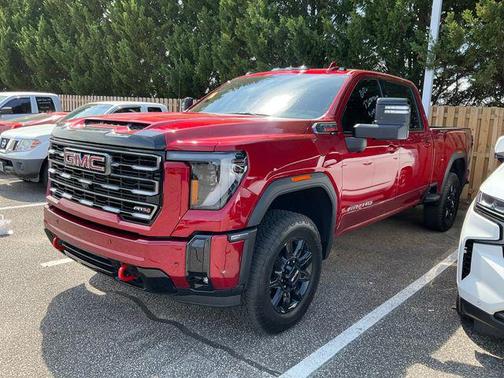 Volcanic Red Tintcoat 2026 GMC Sierra 2500 AT4