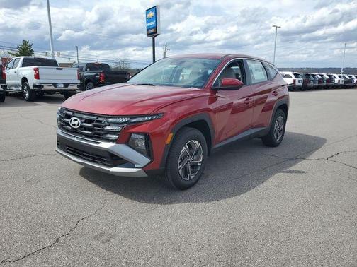 Red 2026 Hyundai TUCSON Hybrid Blue SE