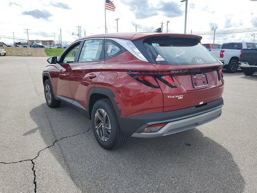 Red 2026 Hyundai TUCSON Hybrid Blue SE