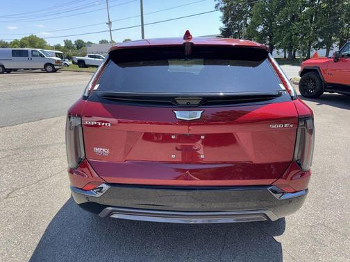 Radiant Red Tintcoat 2025 Cadillac OPTIQ Sport 2 AWD