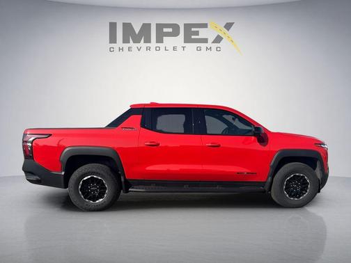 Orange 2026 Chevrolet Silverado EV Trail Boss - Max Range