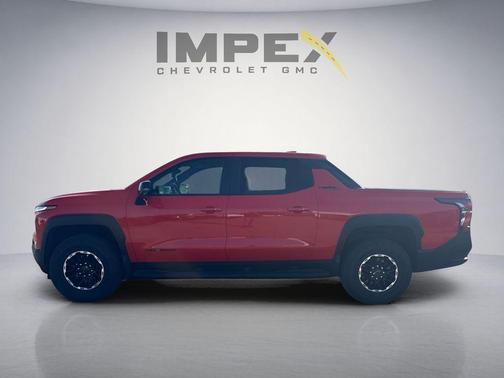 Orange 2026 Chevrolet Silverado EV Trail Boss - Max Range