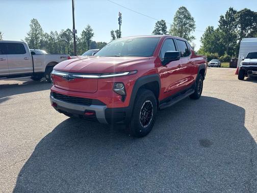 Orange 2026 Chevrolet Silverado EV Trail Boss - Max Range