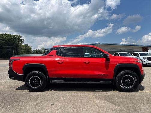 Orange 2026 Chevrolet Silverado EV Trail Boss - Max Range