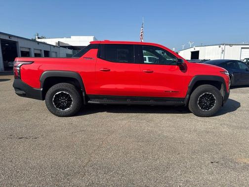 Orange 2026 Chevrolet Silverado EV Trail Boss - Max Range