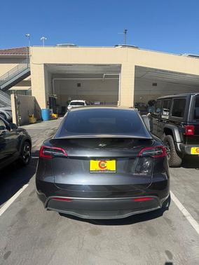 Solid Black 2024 Tesla Model Y Performance Dual Motor All-Wheel Drive