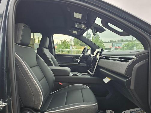 Deep Ocean Metallic 2026 GMC Sierra EV Standard Range Elevation