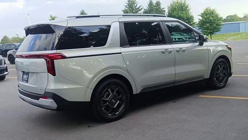 Ivory 2025 Kia Carnival Hybrid EX