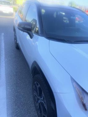 Wind Chill Pearl/Midnight Black Metallic 2025 Toyota RAV4 Hybrid SE