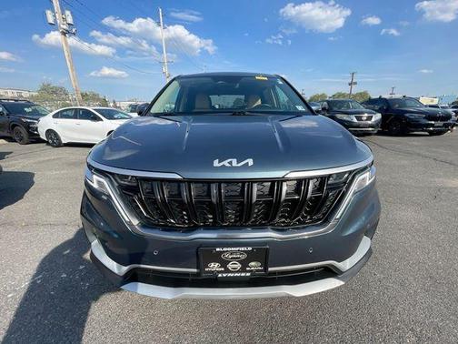 Blue 2024 Kia Carnival EX