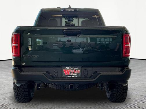 Serrano Green Metallic 2026 RAM 1500 RHO Crew Cab 4x4 5'7' Box