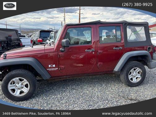 Red 2009 Jeep Wrangler Unlimited X