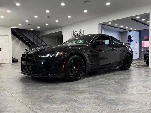 Black Sapphire Metallic 2025 BMW M4 Competition xDrive