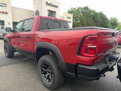 Red 2026 RAM 1500 RHO Crew Cab 4x4 5'7' Box