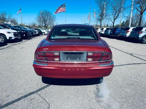 Red 1999 Buick Park Avenue Base