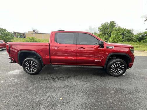 Volcanic Red Tintcoat 2026 GMC Sierra 1500 AT4