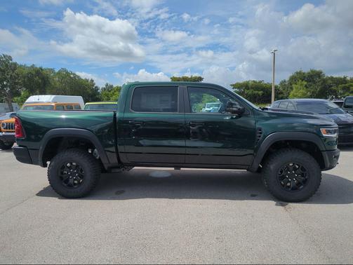 Serrano Green Metallic 2026 RAM 1500 RHO Crew Cab 4x4 5'7' Box