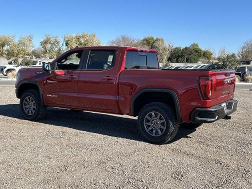 Volcanic Red Tintcoat 2026 GMC Sierra 1500 AT4X