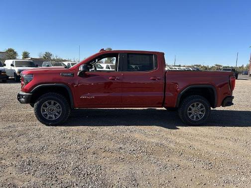 Volcanic Red Tintcoat 2026 GMC Sierra 1500 AT4X