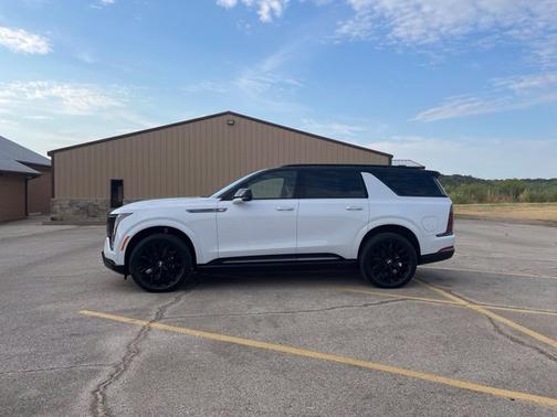 Vibrant White Tricoat 2026 Cadillac Escalade IQL Premium Sport