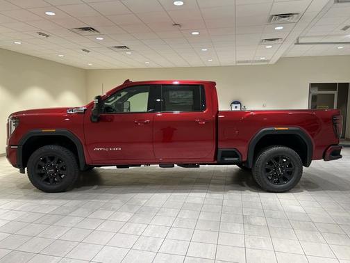 Volcanic Red Tintcoat 2026 GMC Sierra 2500 AT4