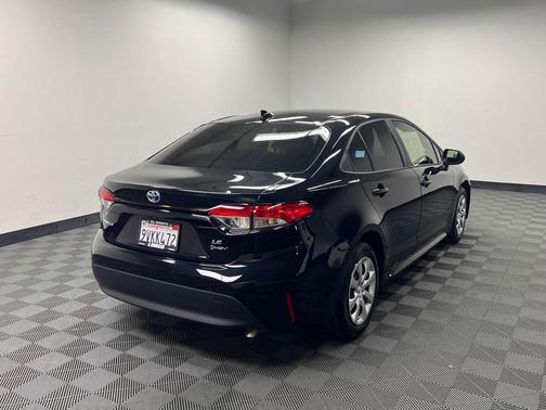Midnight Black Metallic 2025 Toyota Corolla Hybrid LE