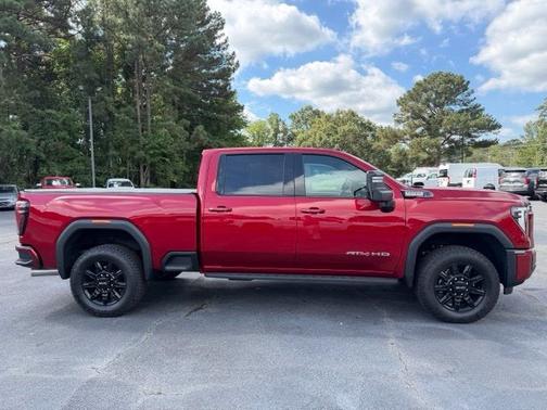 Volcanic Red Tintcoat 2026 GMC Sierra 2500 AT4