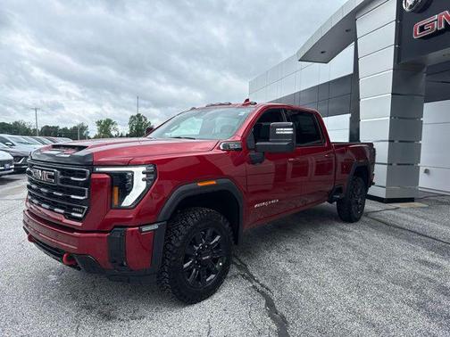 Volcanic Red Tintcoat 2026 GMC Sierra 2500 AT4