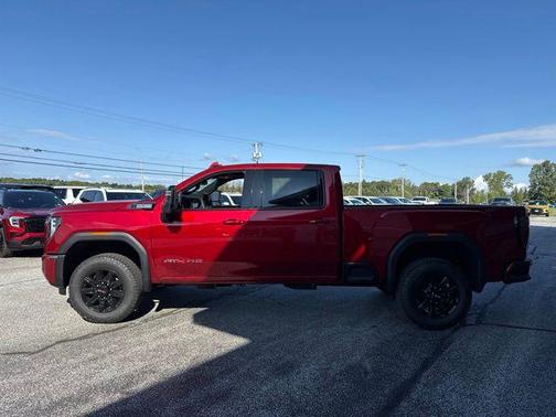 Volcanic Red Tintcoat 2026 GMC Sierra 2500 AT4