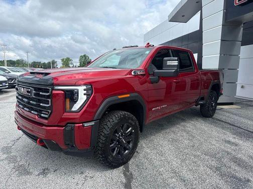 Volcanic Red Tintcoat 2026 GMC Sierra 3500 AT4