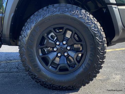 Serrano Green Metallic 2026 RAM 1500 RHO Crew Cab 4x4 5'7' Box