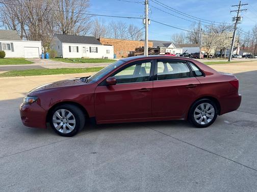 ORANGE 2009 Subaru Impreza 2.5 i