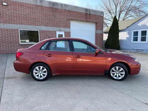 ORANGE 2009 Subaru Impreza 2.5 i