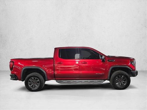 Volcanic Red Tintcoat 2024 GMC Sierra 1500 AT4X
