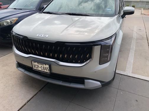 Ivory Silver 2025 Kia Carnival Hybrid EX