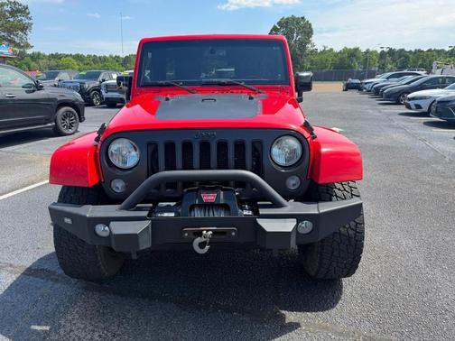 Red 2014 Jeep Wrangler Unlimited Sahara