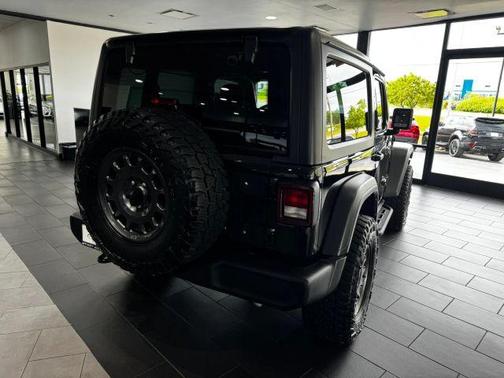 Black 2023 Jeep Wrangler Sport
