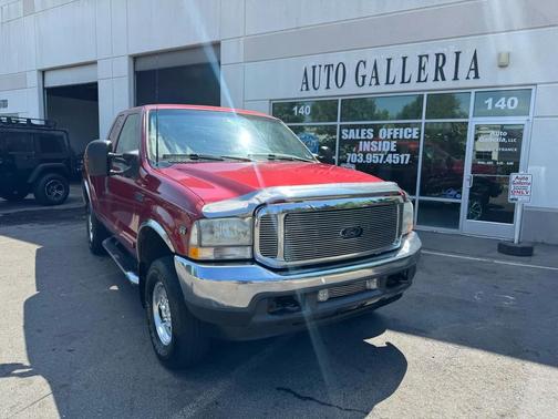 Red 2003 Ford F-250 Lariat