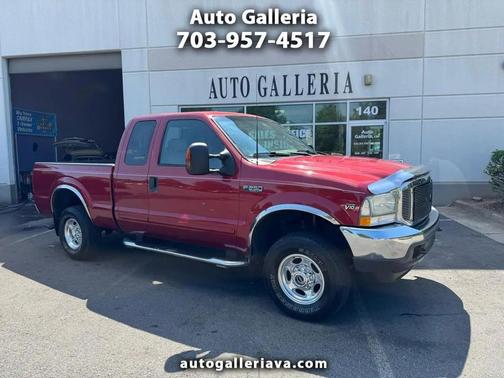 Red 2003 Ford F-250 Lariat