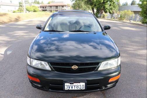 Green 1997 Nissan Maxima GXE