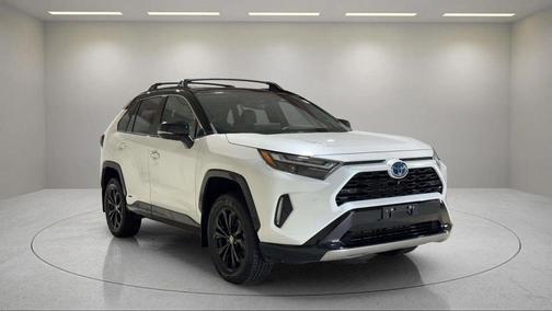 Wind Chill Pearl/Midnight Black Metallic 2023 Toyota RAV4 Hybrid SE