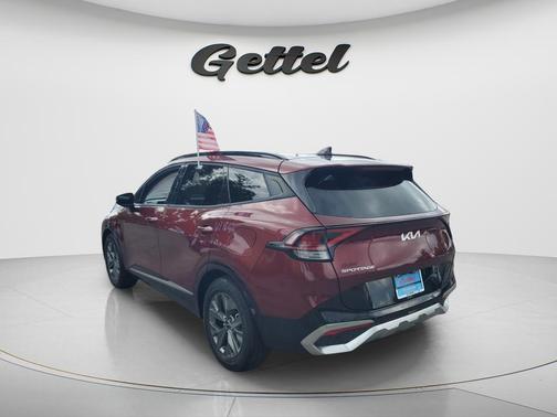 Dawning Red 2023 Kia Sportage SX