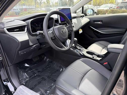 Midnight Black Metallic 2026 Toyota Corolla Hybrid XLE