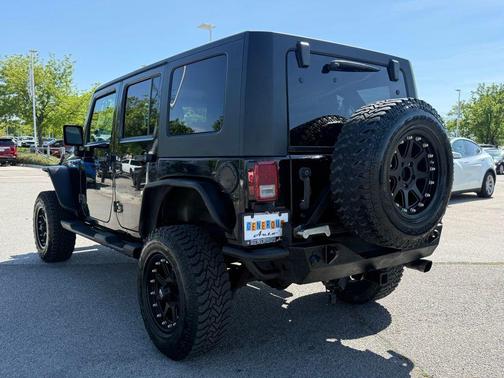 Black Clearcoat / Black Soft Top 2009 Jeep Wrangler Unlimited Sahara