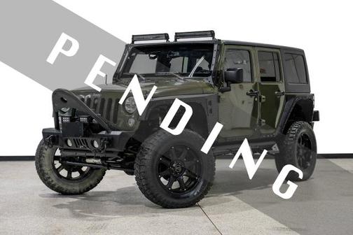 Green 2015 Jeep Wrangler Unlimited Sahara
