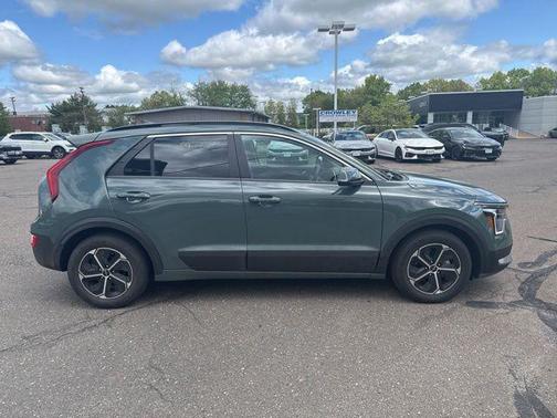 Cityscape Green 2023 Kia Niro Plug-In Hybrid EX