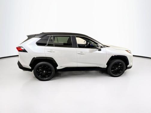 Wind Chill Pearl/Midnight Black Metallic 2024 Toyota RAV4 Hybrid SE