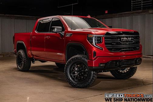 Volcanic Red Tintcoat 2026 GMC Sierra 1500 AT4