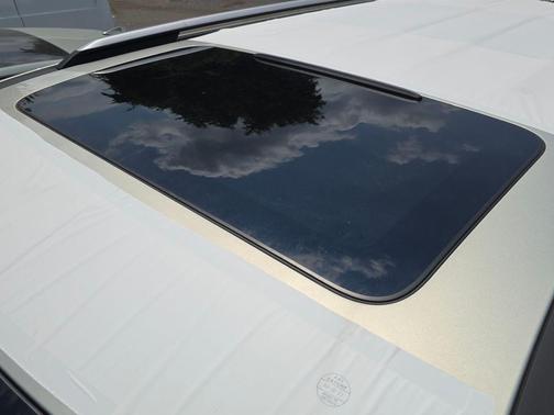 Ivory Silver 2026 Kia Carnival Hybrid SX